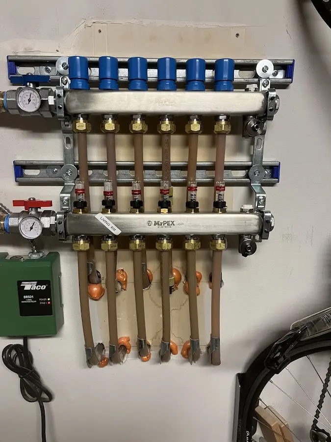 Plumber performing Water Heater Repair at a residential property in Nassau